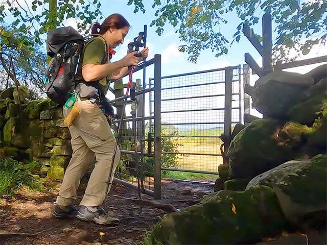 Opening a gate while walking the West Highland Way